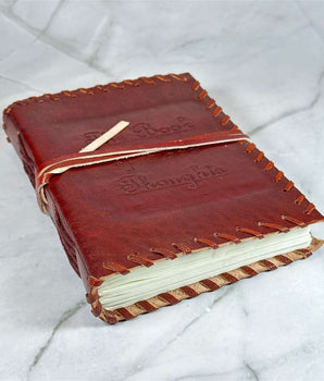 Carnet en cuir Livre des Pensées - Aeternum - Carnet en cuir Livre des Pensées - Aeternum - a red suitcase is sitting in the snow - # boutique ésoterisme# - #wicca# - # boutique ésoterisme# - #wicca#