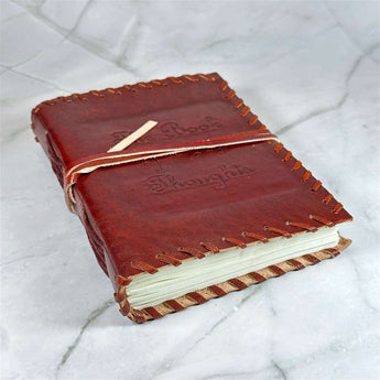 Carnet en cuir Livre des Pensées - Aeternum - Carnet en cuir Livre des Pensées - Aeternum - a red suitcase is sitting in the snow - # boutique ésoterisme# - #wicca# - # boutique ésoterisme# - #wicca#