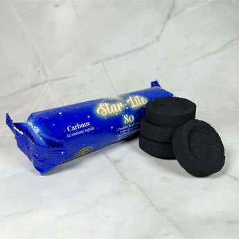 Charbon ardent qualité supérieure 40mm (pack x8) - Aeternum - Charbon ardent qualité supérieure 40mm (pack x8) - Aeternum - a blue pair of shoes sitting on top of a bed - # boutique ésoterisme# - #wicca# - # boutique ésoterisme# - #wicca#