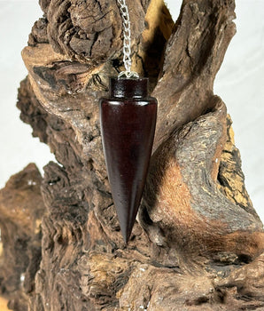 Pendule Cône en bois de rose - Aeternum - a close up of a vase on a rock - # boutique ésoterisme# - #wicca#