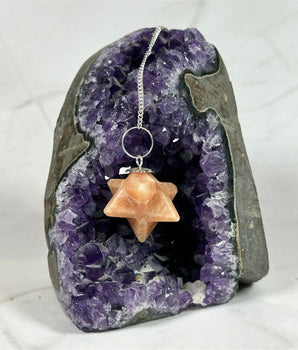 Pendule Merkaba en Tourmaline Rose - Aeternum - a close up of a piece of food on a plate - # boutique ésoterisme# - #wicca#