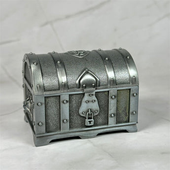 Petit coffre à trésor en métal - Aeternum - a suitcase sitting on top of a snow covered ground - # boutique ésoterisme# - #wicca#