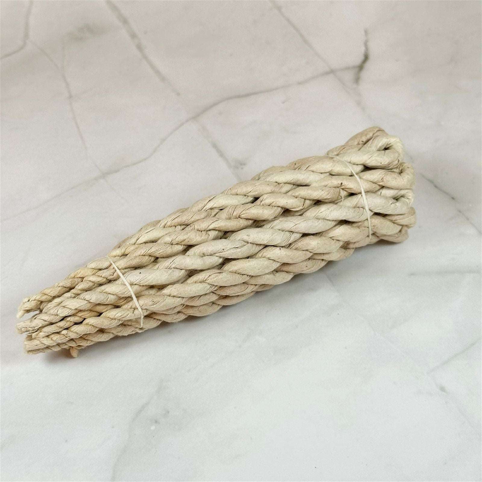 Encens en corde - 3ème chakra (volonté) - Aeternum - Encens en corde - 3ème chakra (volonté) - Aeternum - a piece of bread sitting on top of a white cloth  - # boutique ésoterisme# - #wicca#  - # boutique ésoterisme# - #wicca# 