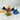 Lot de pierres pyramidales 7 chakras - Aeternum - a bed with two pillows and a blanket  - # boutique ésoterisme# - #wicca# 