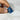 Lot de pierres pyramidales 7 chakras - Aeternum - a person holding a blue and white striped tie  - # boutique ésoterisme# - #wicca# 