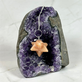 Pendule Merkaba en Tourmaline Rose - Aeternum - a close up of a piece of food on a plate  - # boutique ésoterisme# - #wicca# 