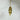 Pendule Témoin de yoga en cuivre doré - Aeternum - a gold clock hanging on a white wall  - # boutique ésoterisme# - #wicca# 